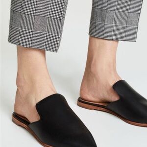 Polished Black Leather Flats with Brown Sole